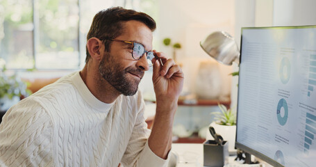 Fototapeta premium Reading, charts and man on computer in home for review of graphs for report, thinking or data analysis. Online, remote work or financial analyst with screen for research, solution or problem solving