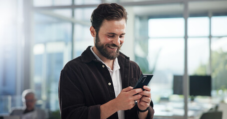 Smile, creative and business man with phone in office for networking, typing text or social media...