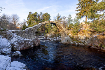 Old Pack Horse Bridge, a historic bridge located in the village of Carrbridge, Scotland, United Kingdom