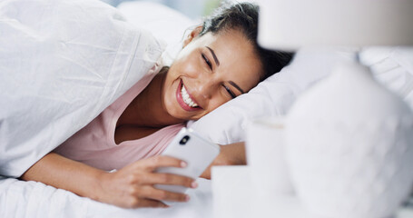 Laughing, wake up or woman with phone in bed for dating website, funny joke or social media meme....