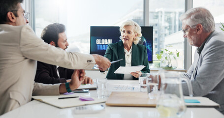 Discussion, serious and group with documents in boardroom, collaboration or negotiation for global trade. Teamwork, colleagues and people with paperwork for international investment, trader and ideas