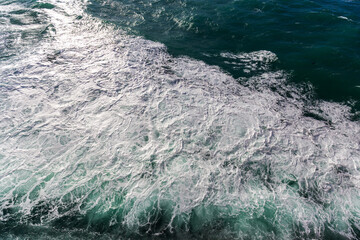 Churning Ocean Foam and Turbulent Waves