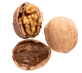 walnuts, cracked and whole, on white background.