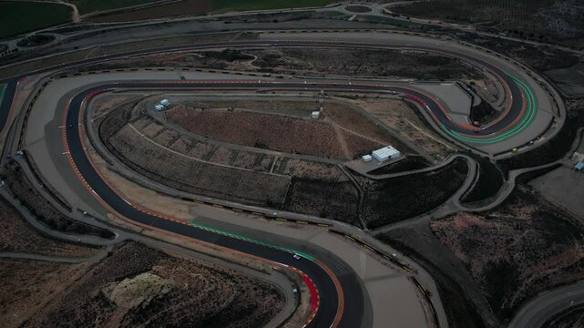 Motorland aerial view in Alcaniz, Spain, while cars are driving through the track. High quality 4k footage