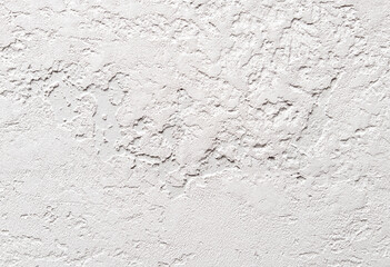 A white wall with a rough texture