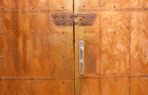 The door is made of metal and has a silver handle