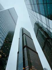 A city skyline with three tall buildings