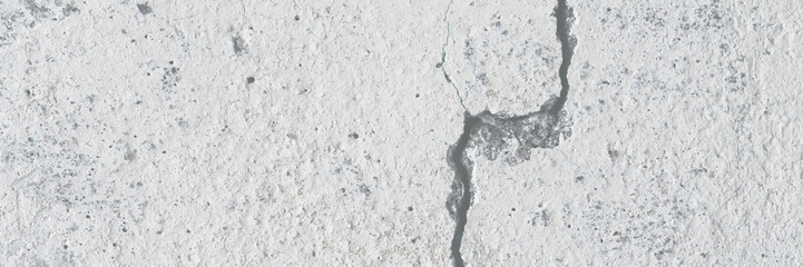 Texture of old cracked concrete wall. Rough gray concrete surface. Great for background and design. Close-up. High resolution.