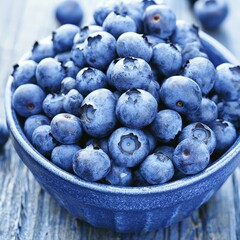 Fresh Blueberries in Blue Bowl on Rustic Wooden Table Background