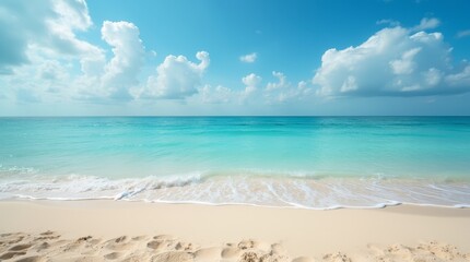 Tropical beach with turquoise ocean waves, golden sand and blue sky with white clouds. Summer vacation and travel background