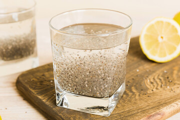 Healthy breakfast or morning with chia seeds and lemon on table background, vegetarian food, diet...