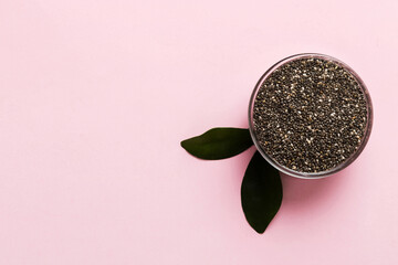 Chia seeds in bowl on colored background. Healthy Salvia hispanica in small bowl. Healthy superfood