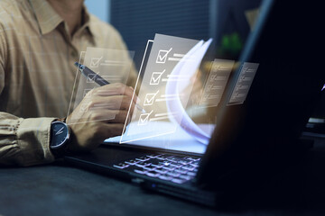 Businessman tick check mark on computer screen for document approve or check list of each item in...