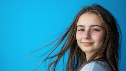 Fototapeta premium Cheerful long-haired girl exudes joy, vibrant energy radiates in a creative moment.