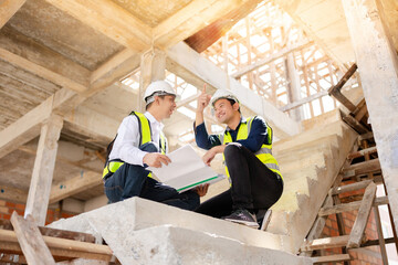 Two male Asian engineers revolutionize the construction industry by developing innovative village design concepts that improve housing accessibility for families to rent and sell.