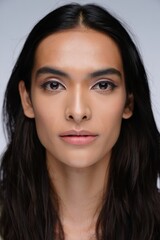 Naklejka premium Female Model with Long Hair in Studio Portrait 