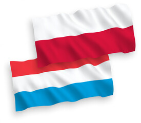Flags of Luxembourg and Poland on a white background