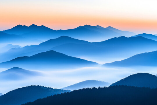 There is a mountain range with a few clouds in the sky