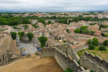 View of Carcassonne ville basse which means lower city with its traditional orange handmade French roof tiles in Aude Occitanie Southern France.	