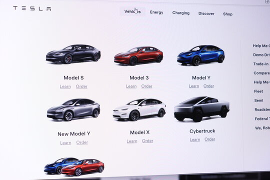 Tesla vehicle lineup display with model s 3 x y and cybertruck on website