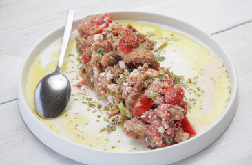 Traditional Cretan summer salad - Barley bagel with grated tomatoes, feta cheese and virgin olive oil