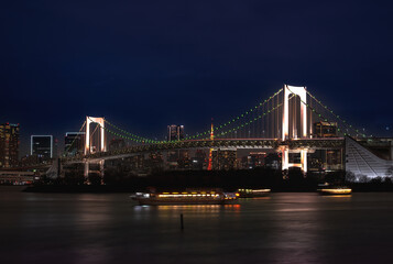 Japan- Kanto Region- Tokyo- Long exposure of Tokyo Bay and Rainbow Bridge at dusk