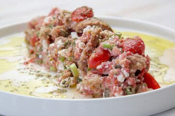 Traditional Cretan summer salad - Barley bagel with grated tomatoes, feta cheese and virgin olive oil