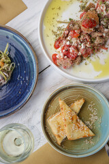 Various Mediterranean dishes served on the restaurant table	