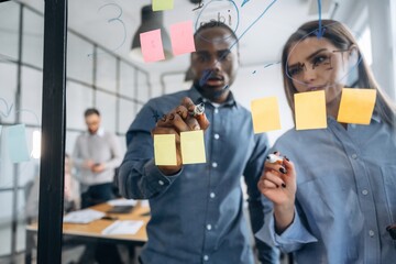 Calculations, planning. Professional workers are in the modern office together