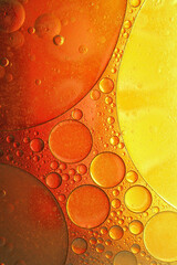 Abstract Macro of Oil and Water Bubbles in Warm Tones. Vibrant abstract macro photography of oil and water bubbles in warm orange and yellow tones. Perfect for backgrounds, textures