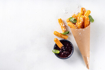 Churros with sugar powder and chocolate