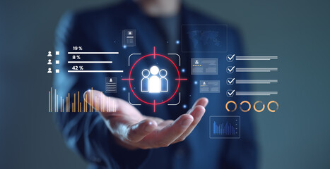 Digital marketing strategy and audience targeting concept. Businessman interacts with data analytics dashboard, customer engagement insights, online advertising, Customer Relationship Management.