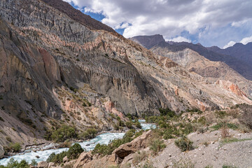 Scenic mountain landscape view of colorful Iskander darya river valley near Iskanderkul lake, Fann mountains, Sughd, Tajikistan