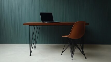Modern wooden desk with laptop and chair in a teal room. Use Stock photo for office interior design or workspace imagery