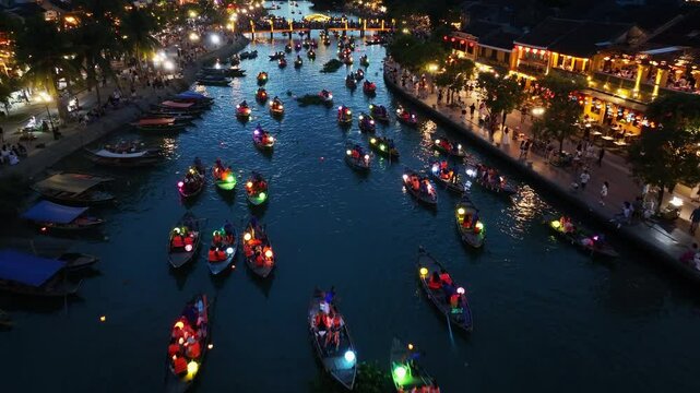 Drone video Hoi An, Vietnam in Quang Nam Province is a popular tourist destination, with colorful lantern boats sailing along the river at night.