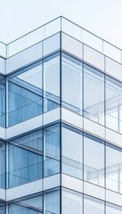Obraz premium A modern glass building showcases sleek lines and transparent design, emphasizing contemporary architecture and urban aesthetics.