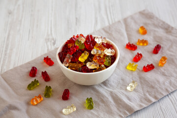Colorful Gummy Bears in a Bowl, side view.