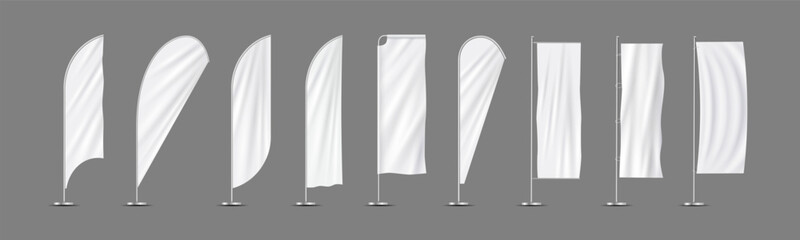 Vector realistic set vertical white flags,textile banners on flagpoles
