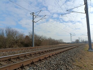 Two way railroad tracks in countryside. Two railway tracks. Sunny day. Countryside. Fields and...