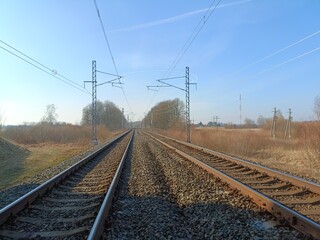 Two way railroad tracks in countryside. Two railway tracks. Sunny day. Countryside. Fields and...