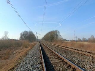 Two way railroad tracks in countryside. Two railway tracks. Sunny day. Countryside. Fields and...