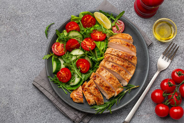 sliced grilled chicken breast with vegetable salad