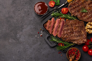 sliced grilled medium rare ribeye steaks