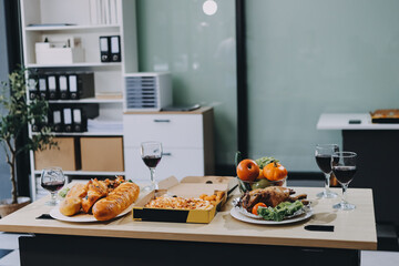 Asian office colleagues and friends enjoy a daytime BBQ with pizza and beer, celebrating Halloween and cheering for their favorite soccer team, creating a lively atmosphere filled with joy.
