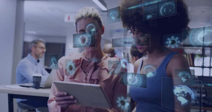 Two women collaborating on tablet with digital data processing animation overlay