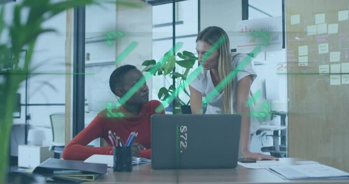 Two women collaborating at office desk with digital data overlay animation