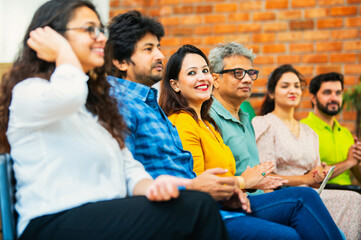Indian Young business professionals gathering for corporate training session in professional office
