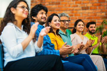 Indian Young business professionals gathering for corporate training session in professional office