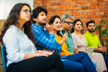 Indian Young business professionals gathering for corporate training session in professional office