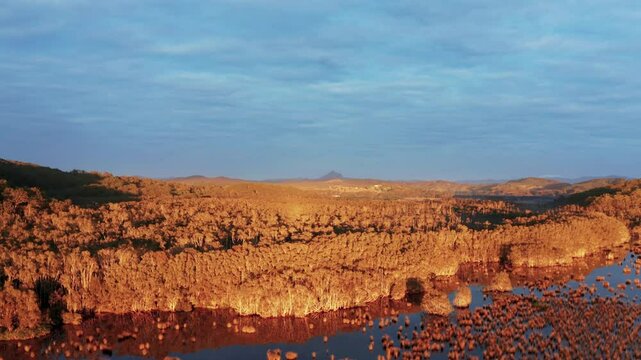 Experience a gorgeous drone pan over Mt Warning, NSW, capturing golden wetlands, lush landscapes, and stunning reflections. Perfect for travel, nature, and cinematic stock footage needs.
